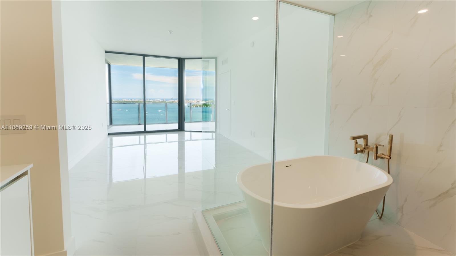 700 Northeast 24th Street, Unit 4407 Miami, FL 33137 - Photo 63 of 75 a bathroom with a shower