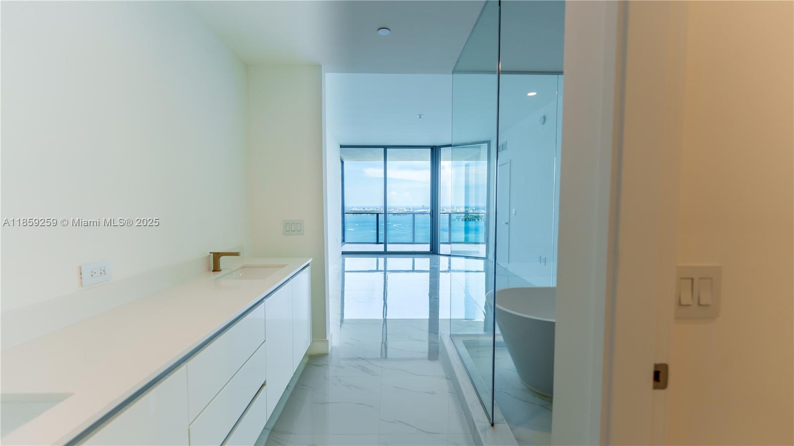 700 Northeast 24th Street, Unit 4407 Miami, FL 33137 - Photo 64 of 75 a bathroom with a tub and sink