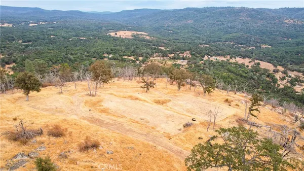 a view of an outdoor space and a mountain