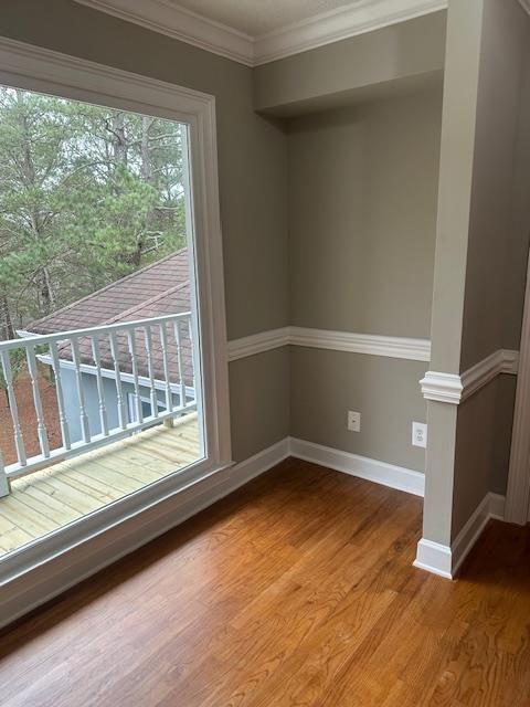 370 Buchanan Circle Dallas, GA 30157 - Photo 3 of 54 a view of an empty room with wooden floor and a window
