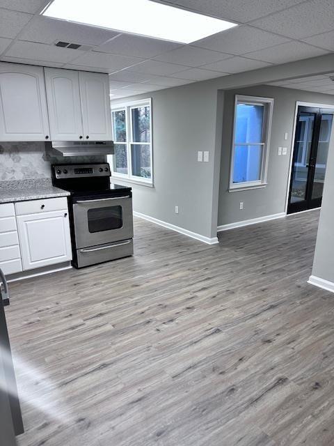 370 Buchanan Circle Dallas, GA 30157 - Photo 50 of 54 a kitchen with granite countertop wooden cabinets and black appliances