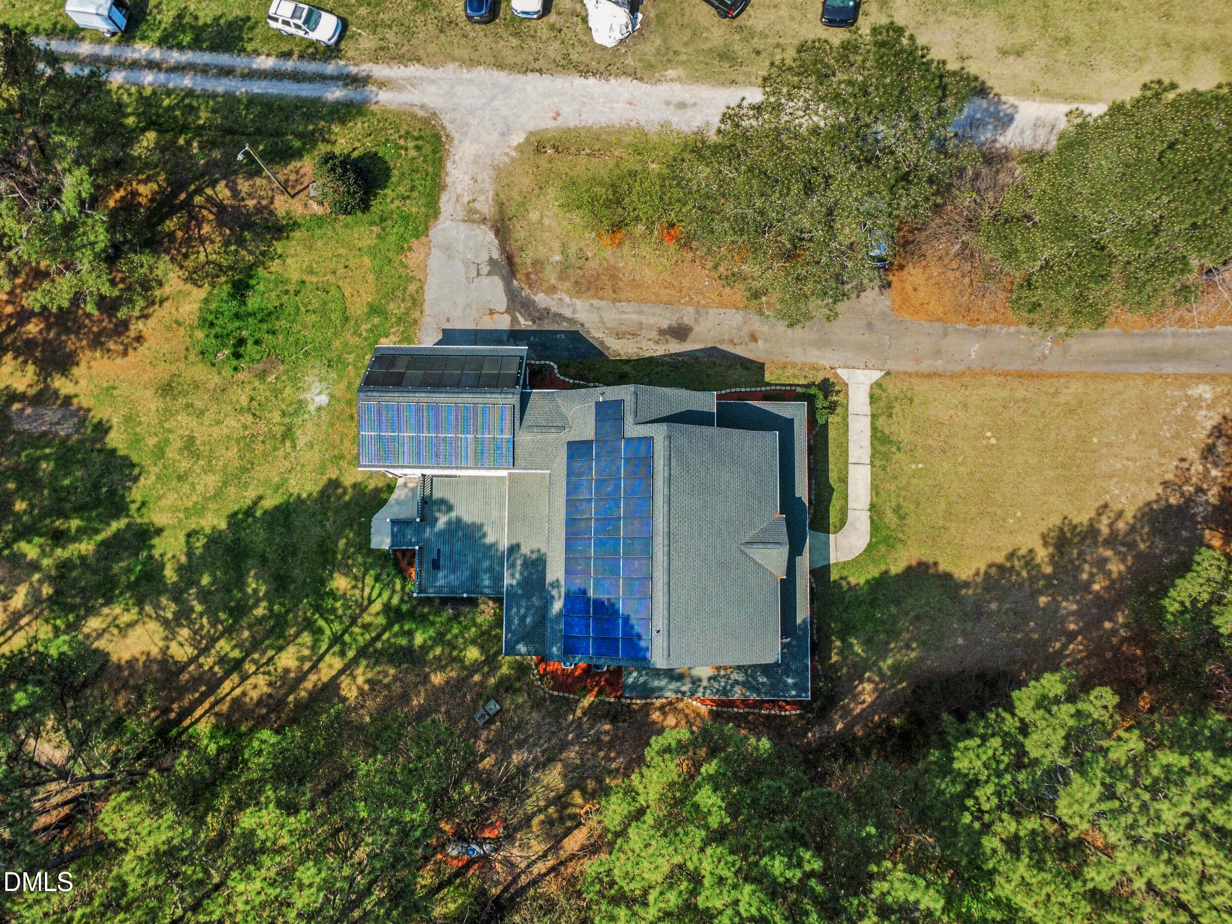 1957 Hilltop Road Raleigh, NC 27610 - Photo 43 of 46 an aerial view of a house with a yard and lake view