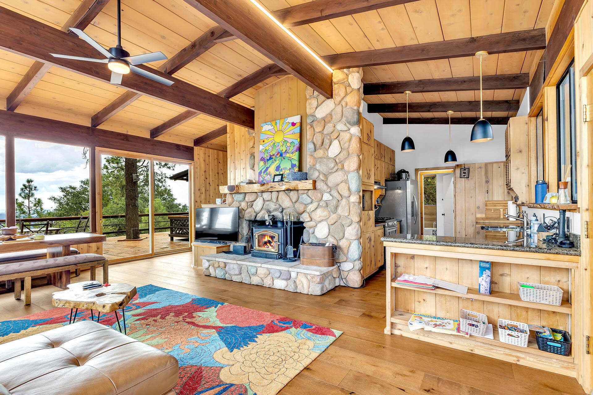 27011 Lookout Lane Idyllwild, CA 92549 - Photo 13 of 68 a living room with fireplace furniture and a large window