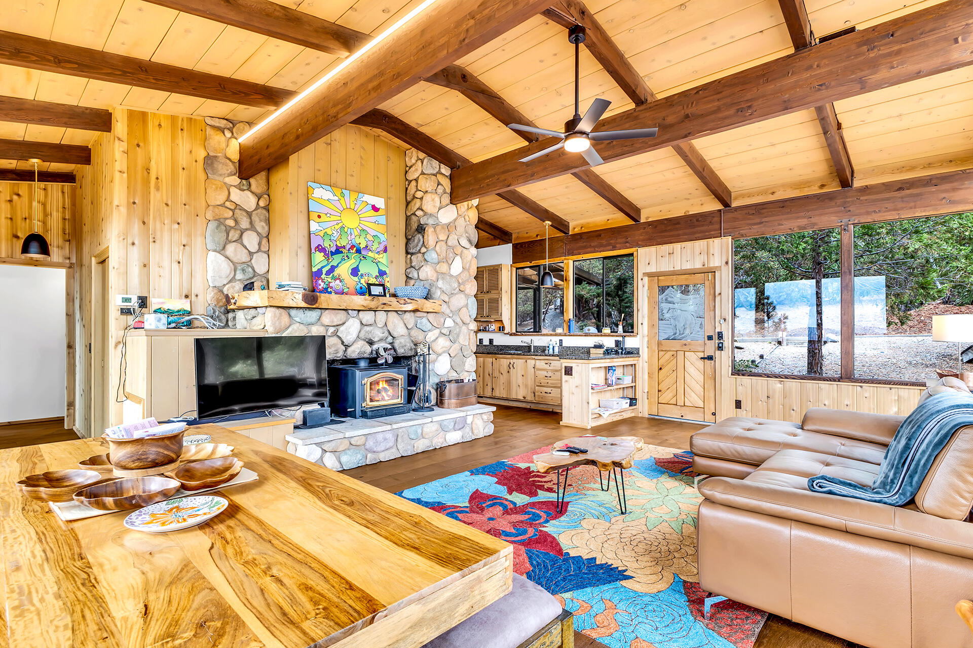 27011 Lookout Lane Idyllwild, CA 92549 - Photo 15 of 68 a living room with fireplace furniture and a floor to ceiling window