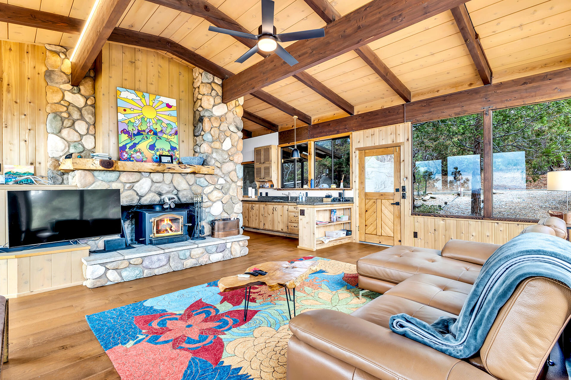 27011 Lookout Lane Idyllwild, CA 92549 - Photo 16 of 68 a living room with fireplace furniture and a large window