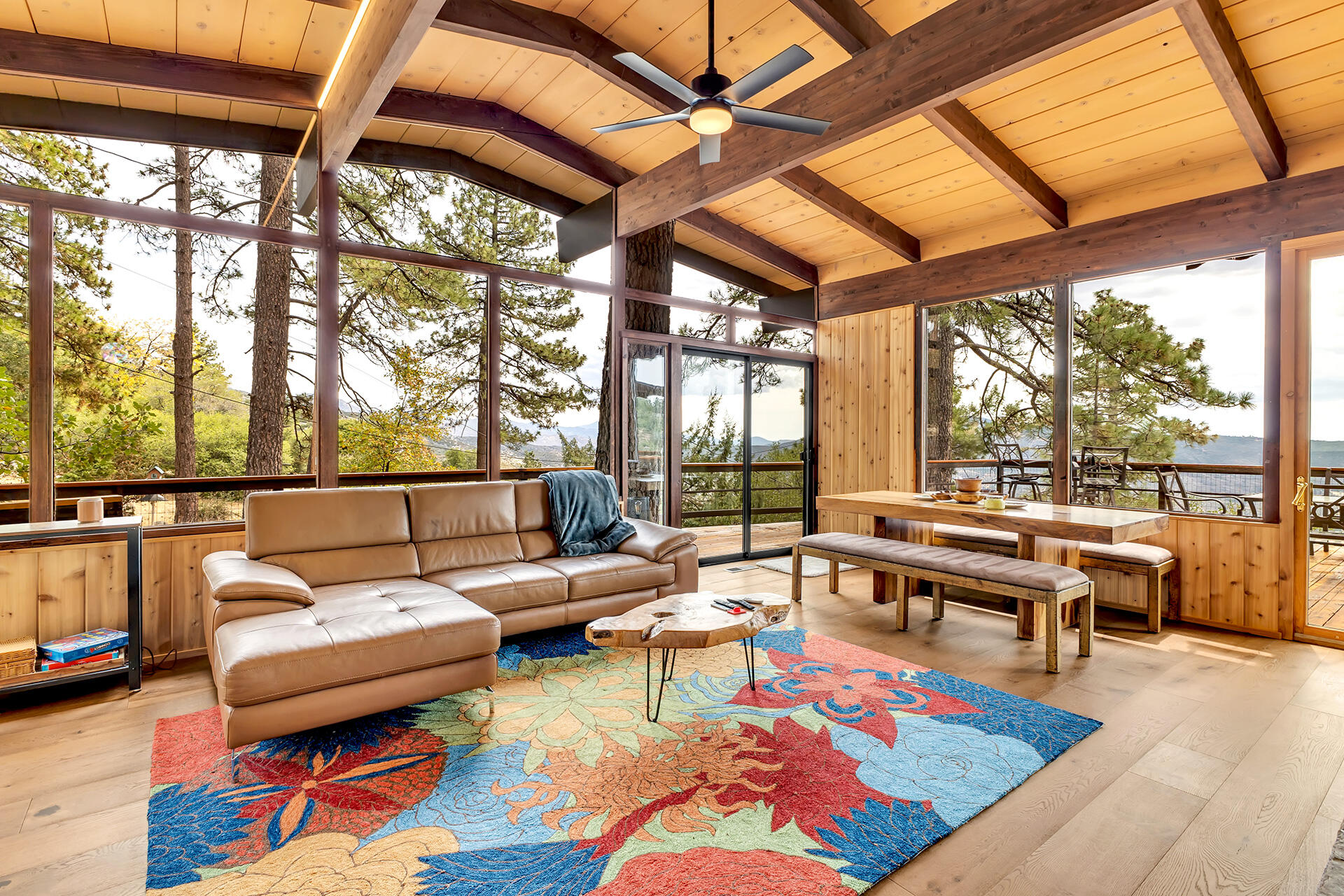 27011 Lookout Lane Idyllwild, CA 92549 - Photo 18 of 68 a living room with furniture a rug and a large window
