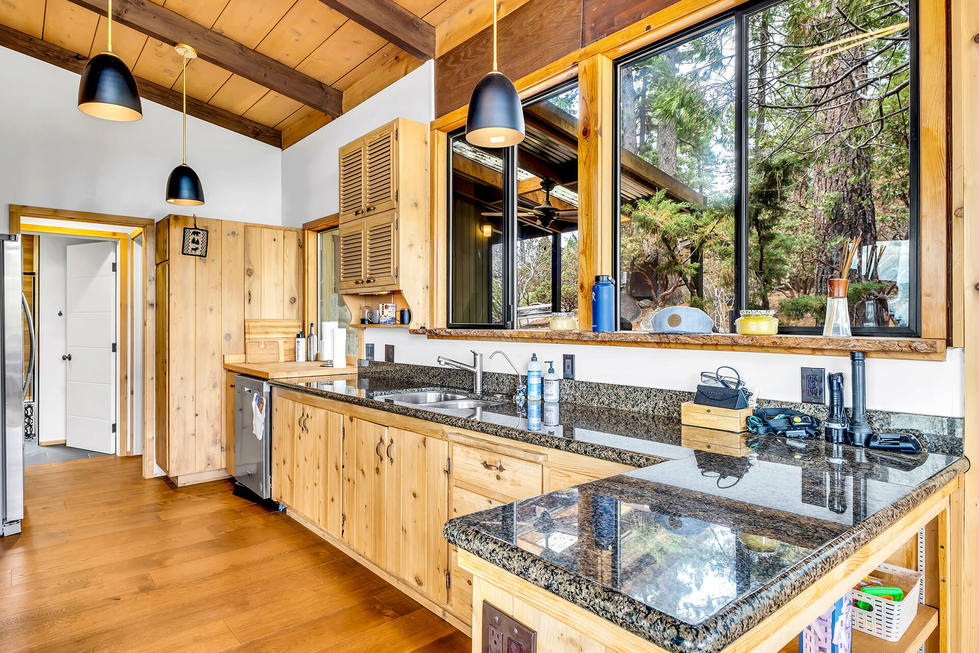 27011 Lookout Lane Idyllwild, CA 92549 - Photo 21 of 68 a kitchen with granite countertop a sink and a refrigerator