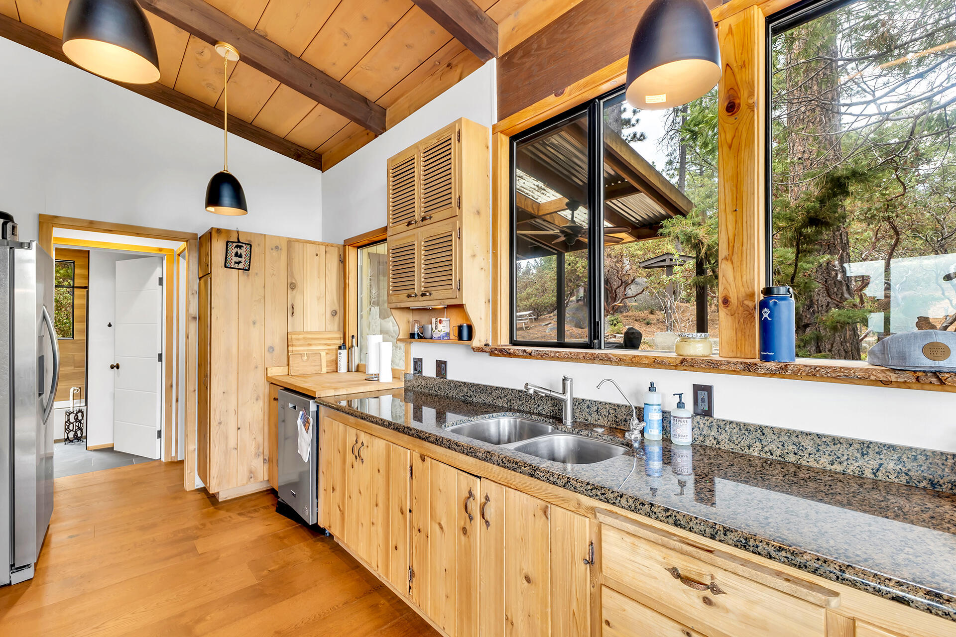 27011 Lookout Lane Idyllwild, CA 92549 - Photo 25 of 68 a bathroom with a double vanity sink and a bathtub