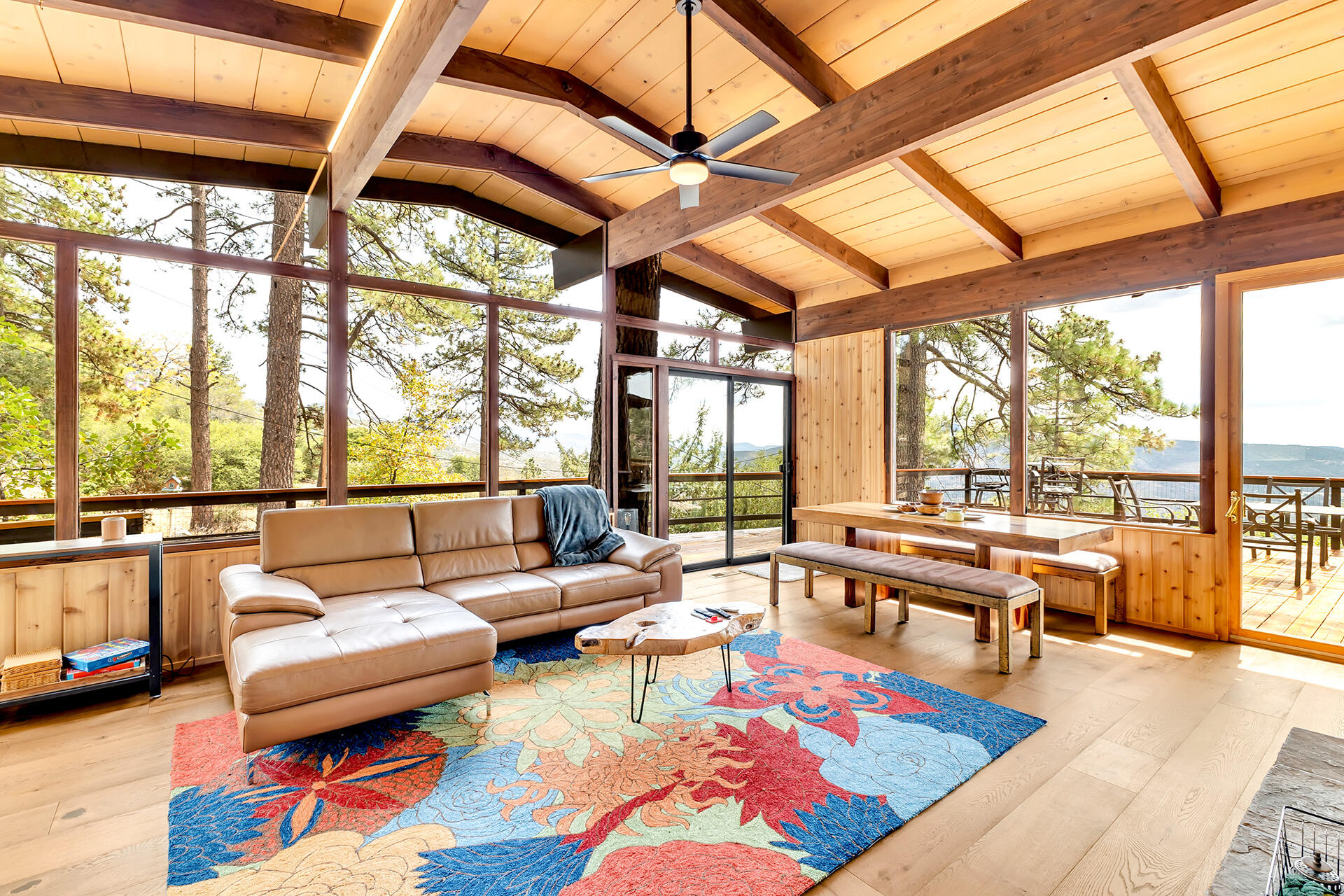 27011 Lookout Lane Idyllwild, CA 92549 - Photo 30 of 68 a living room with furniture a rug and a large window