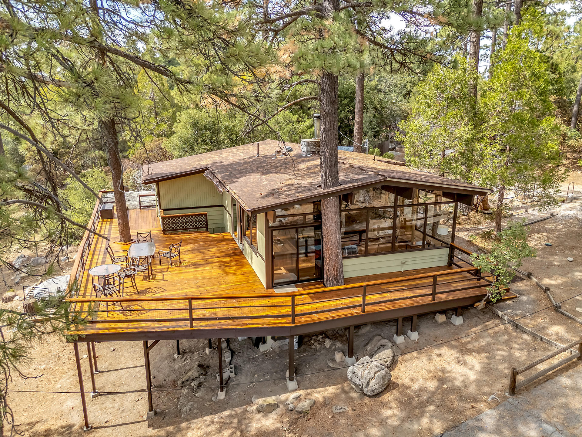 27011 Lookout Lane Idyllwild, CA 92549 - Photo 3 of 68 a view of a roof deck with wooden fence and a couple of chairs