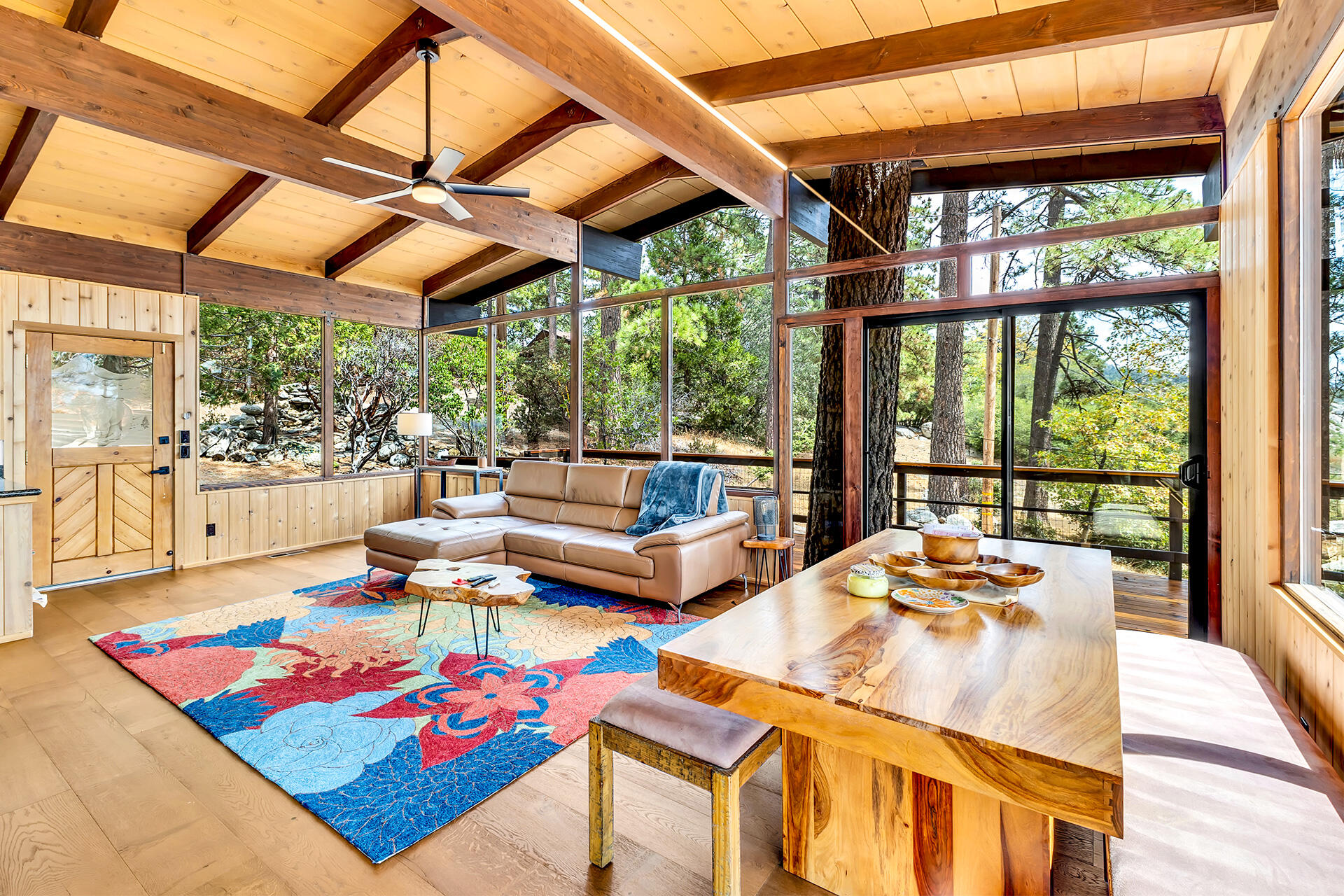 27011 Lookout Lane Idyllwild, CA 92549 - Photo 32 of 68 a living room with patio furniture and a table