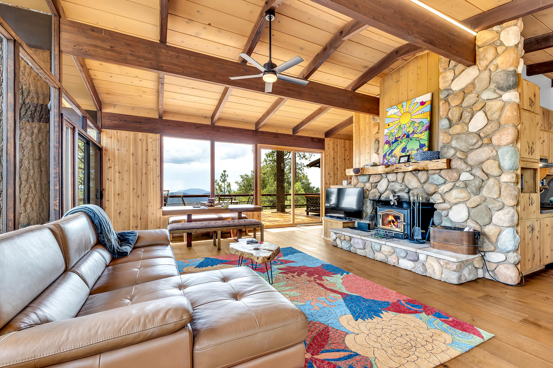 27011 Lookout Lane Idyllwild, CA 92549 - Photo 33 of 68 a living room with furniture and a fireplace