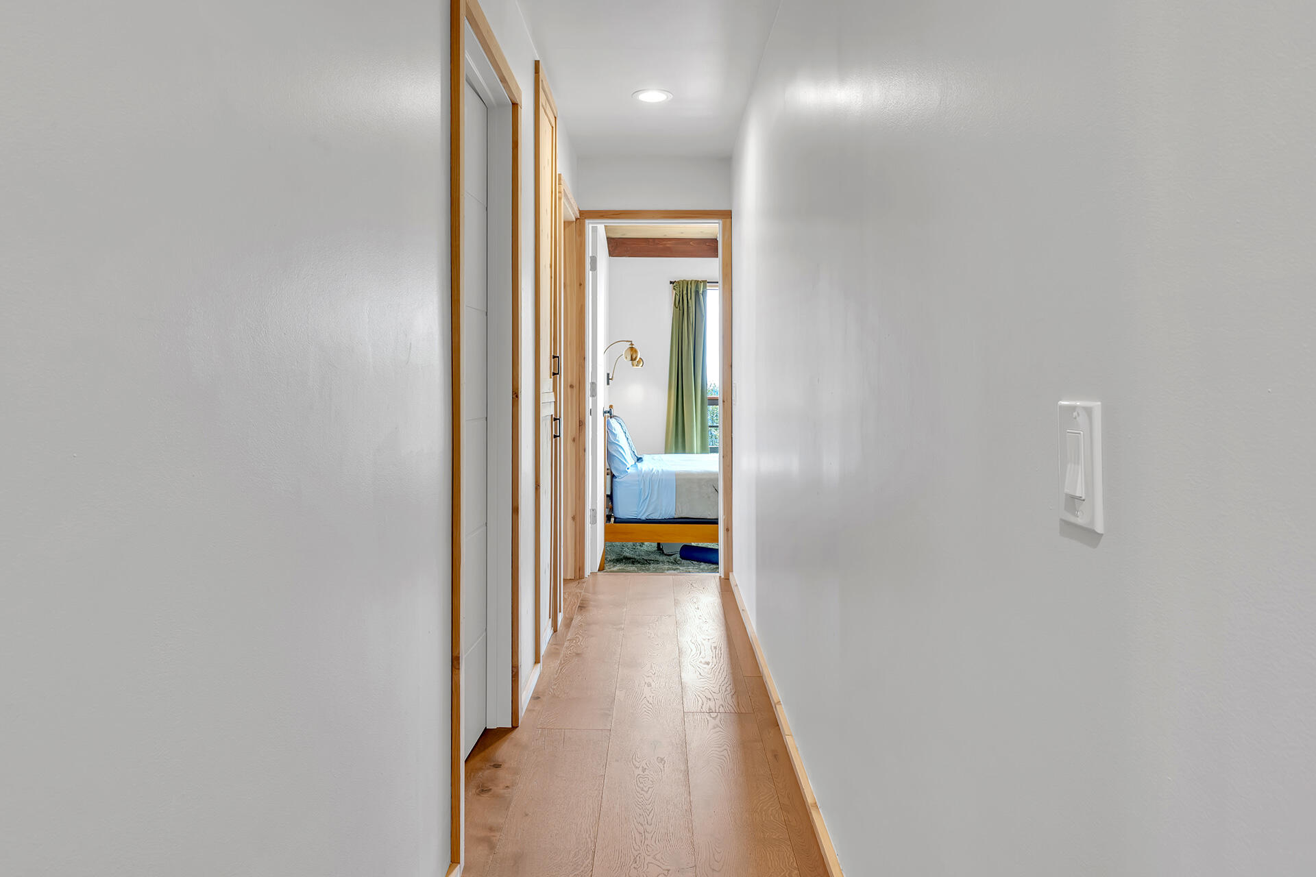 27011 Lookout Lane Idyllwild, CA 92549 - Photo 36 of 68 a view of a hallway with wooden floor and a bathroom