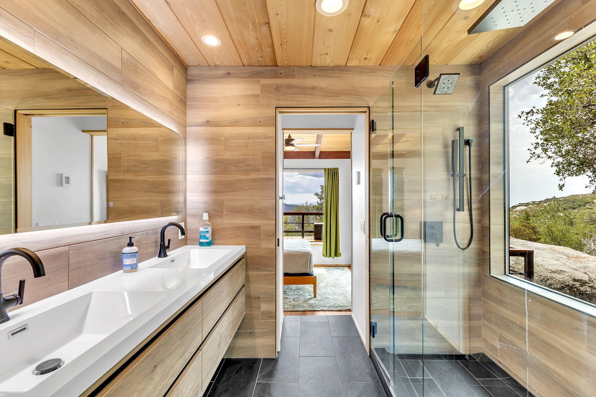 27011 Lookout Lane Idyllwild, CA 92549 - Photo 43 of 68 a bathroom with a double vanity sink and mirror