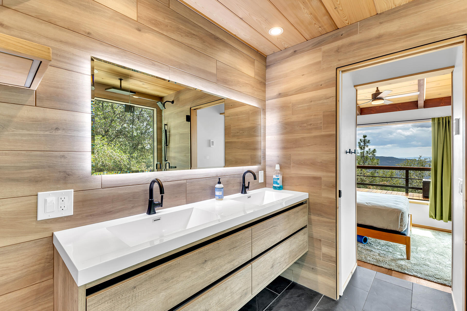 27011 Lookout Lane Idyllwild, CA 92549 - Photo 44 of 68 a bathroom with a sink and a large mirror
