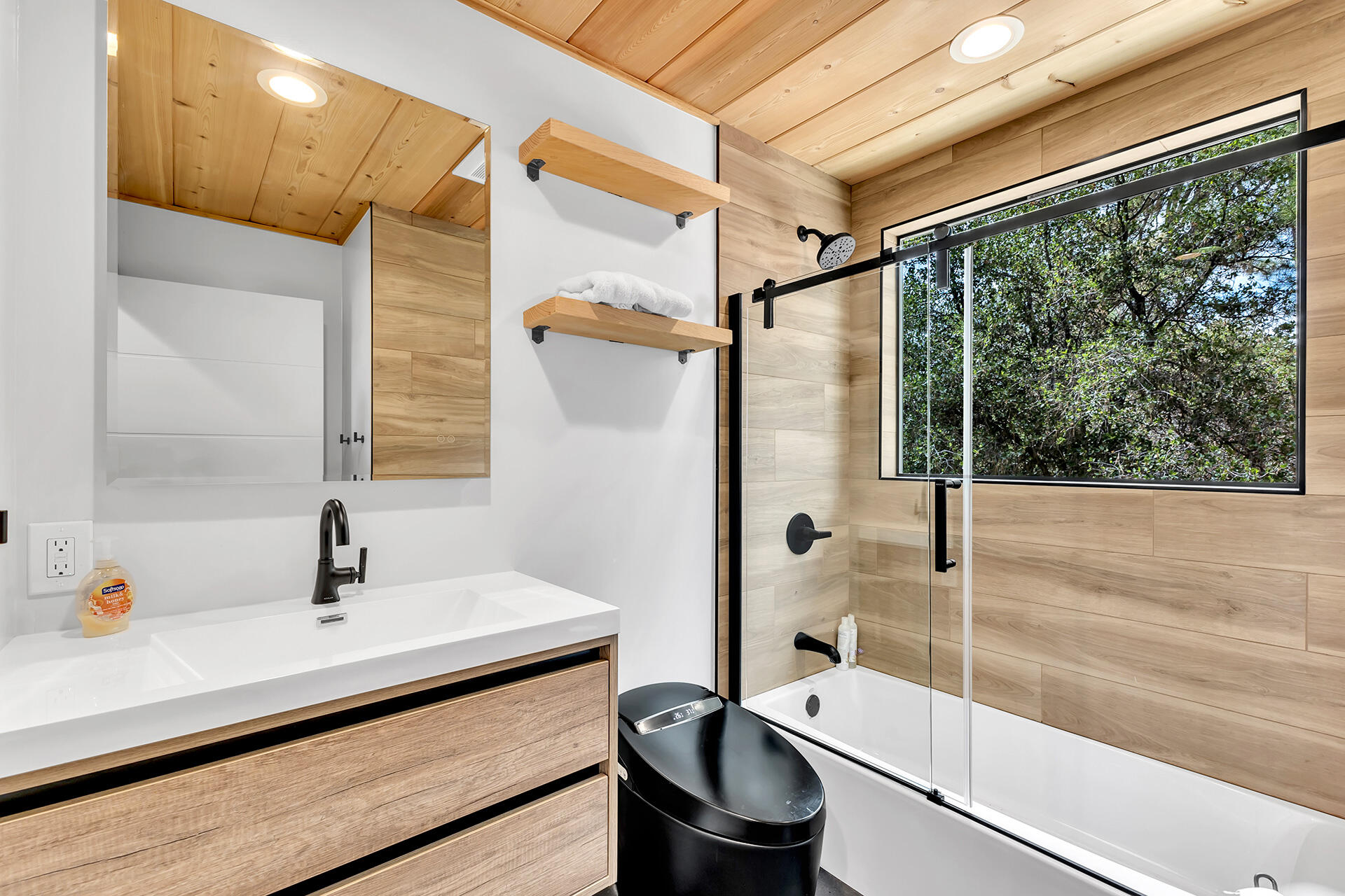 27011 Lookout Lane Idyllwild, CA 92549 - Photo 52 of 68 a bathroom with a sink and a large mirror