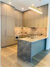 202 Nueces Street, Unit 2204 Austin, TX 78701 - Photo 3 of 9 a bathroom with a granite countertop sink and a mirror