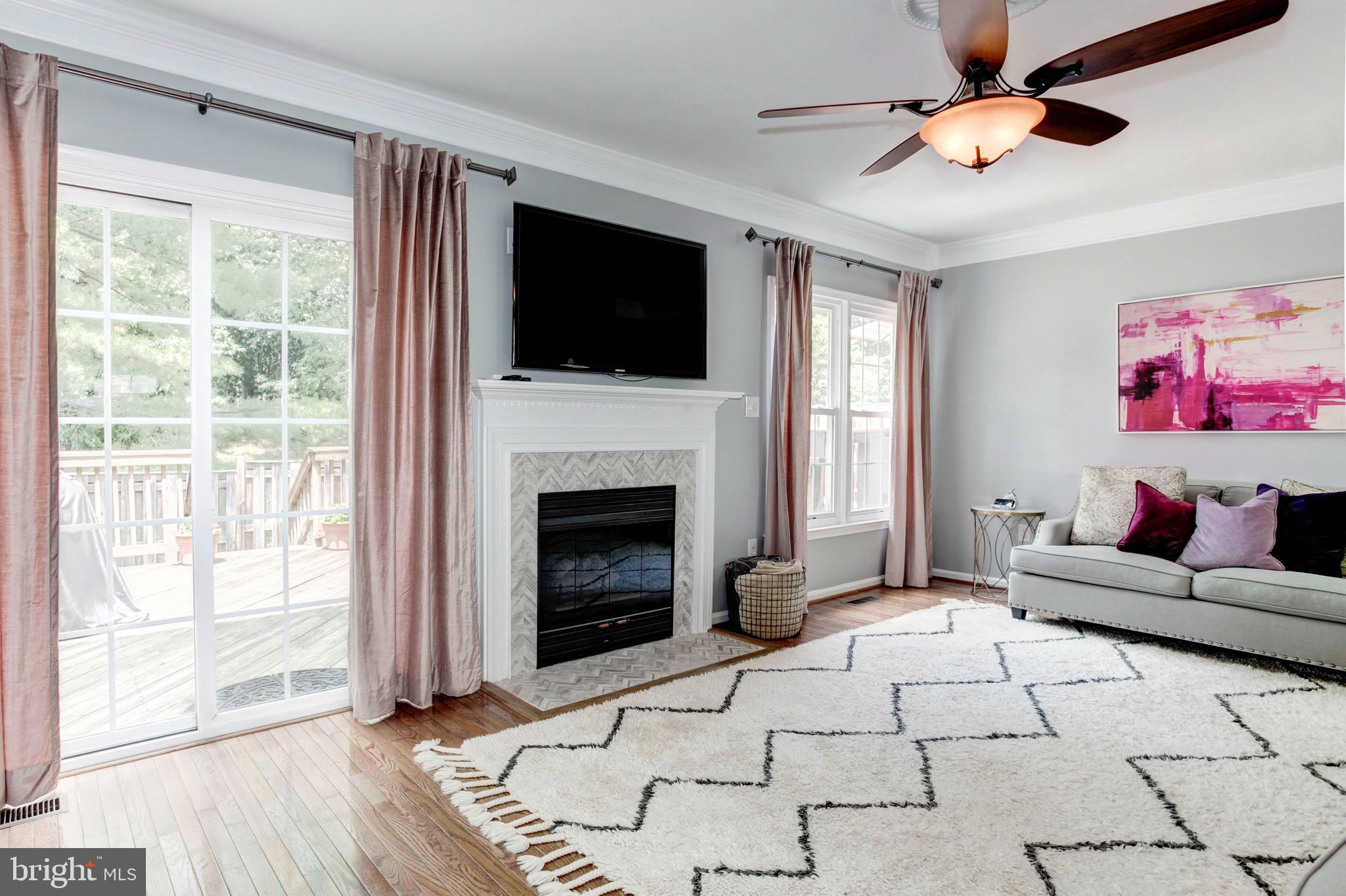 7728 Hickory Glen Way Springfield, VA 22153 - Photo 12 of 26 a living room with furniture and a fireplace