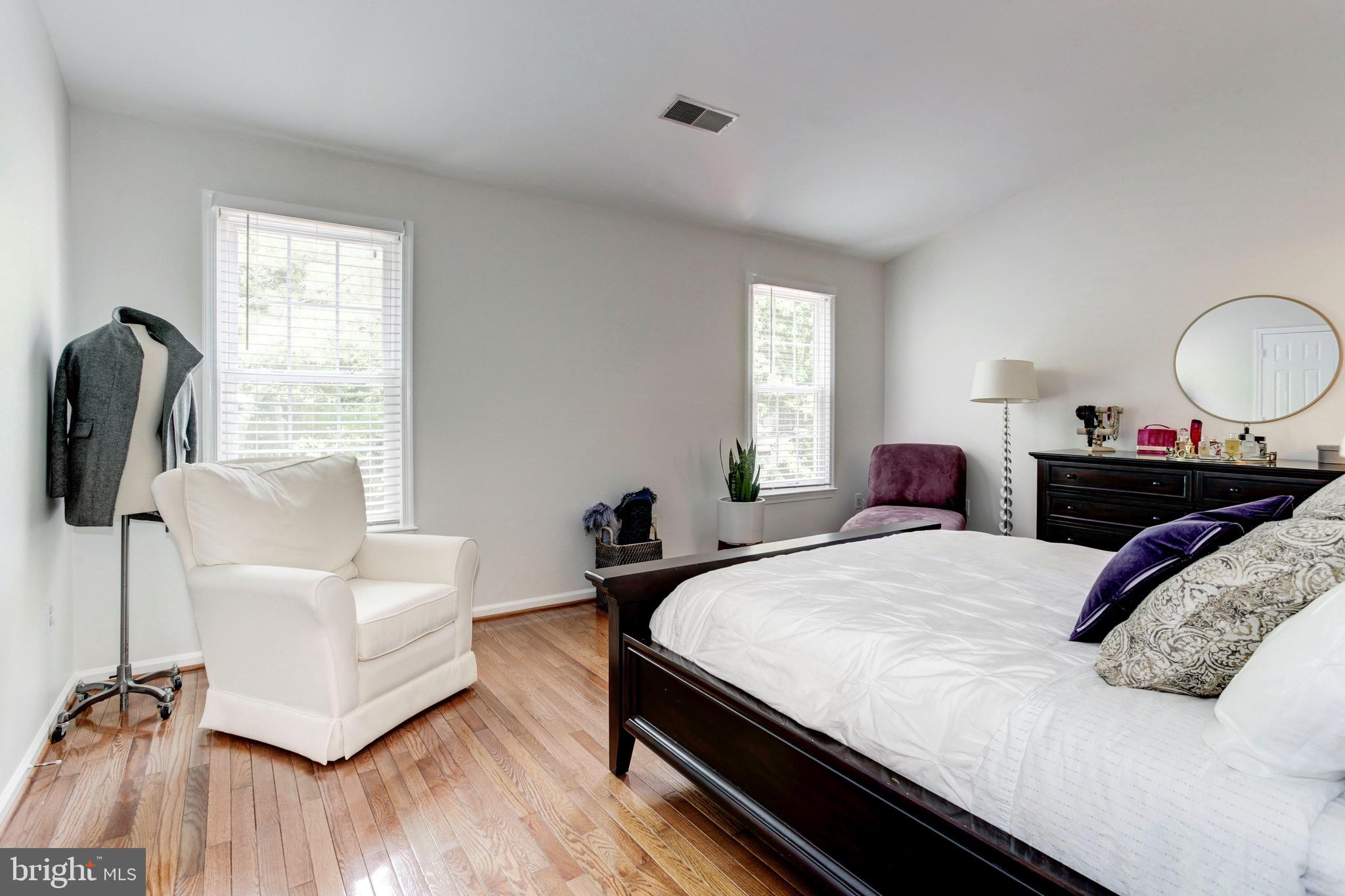 7728 Hickory Glen Way Springfield, VA 22153 - Photo 15 of 26 a bedroom with a bed and a couch