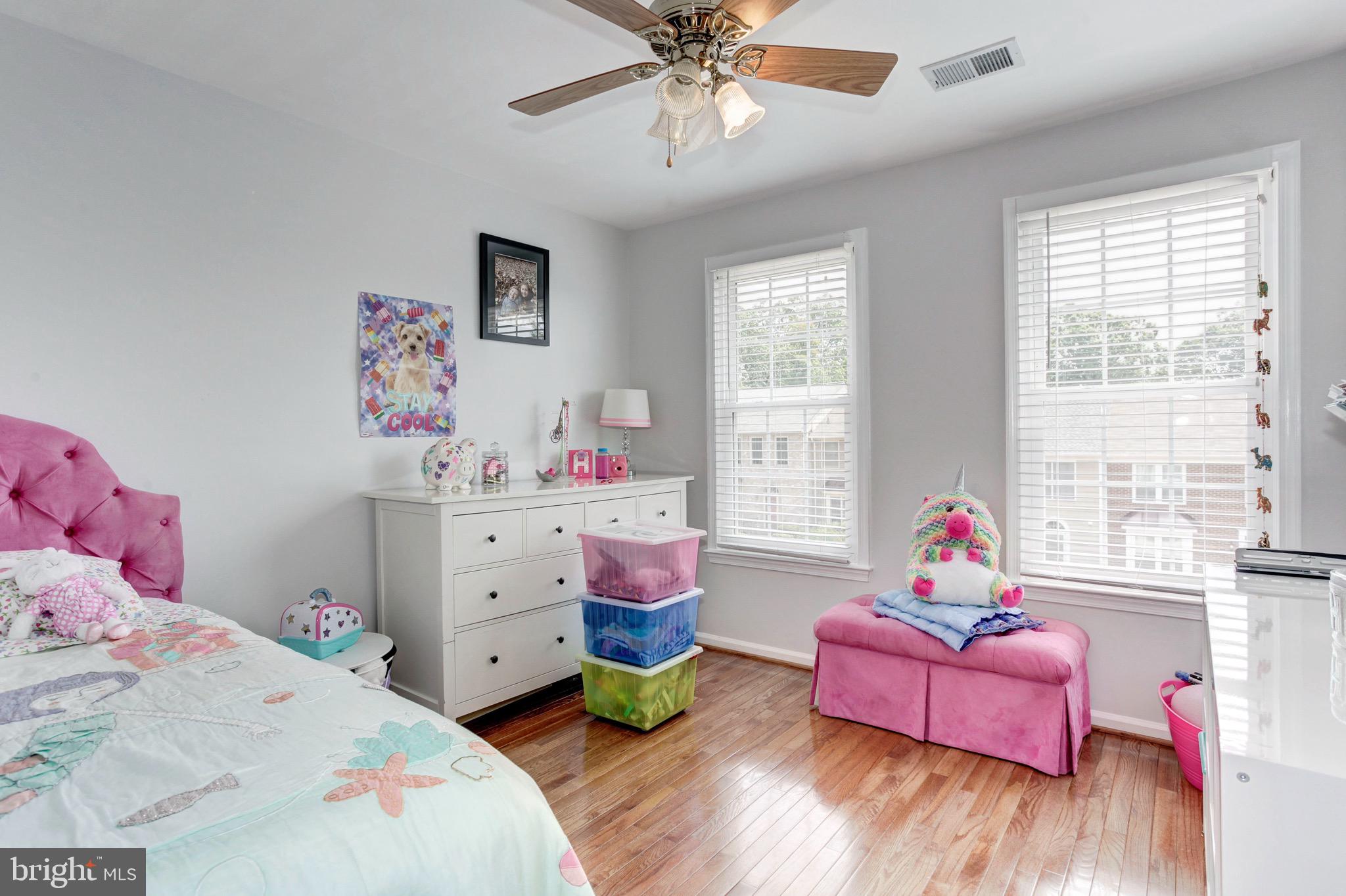 7728 Hickory Glen Way Springfield, VA 22153 - Photo 17 of 26 a bedroom with a bed and a window