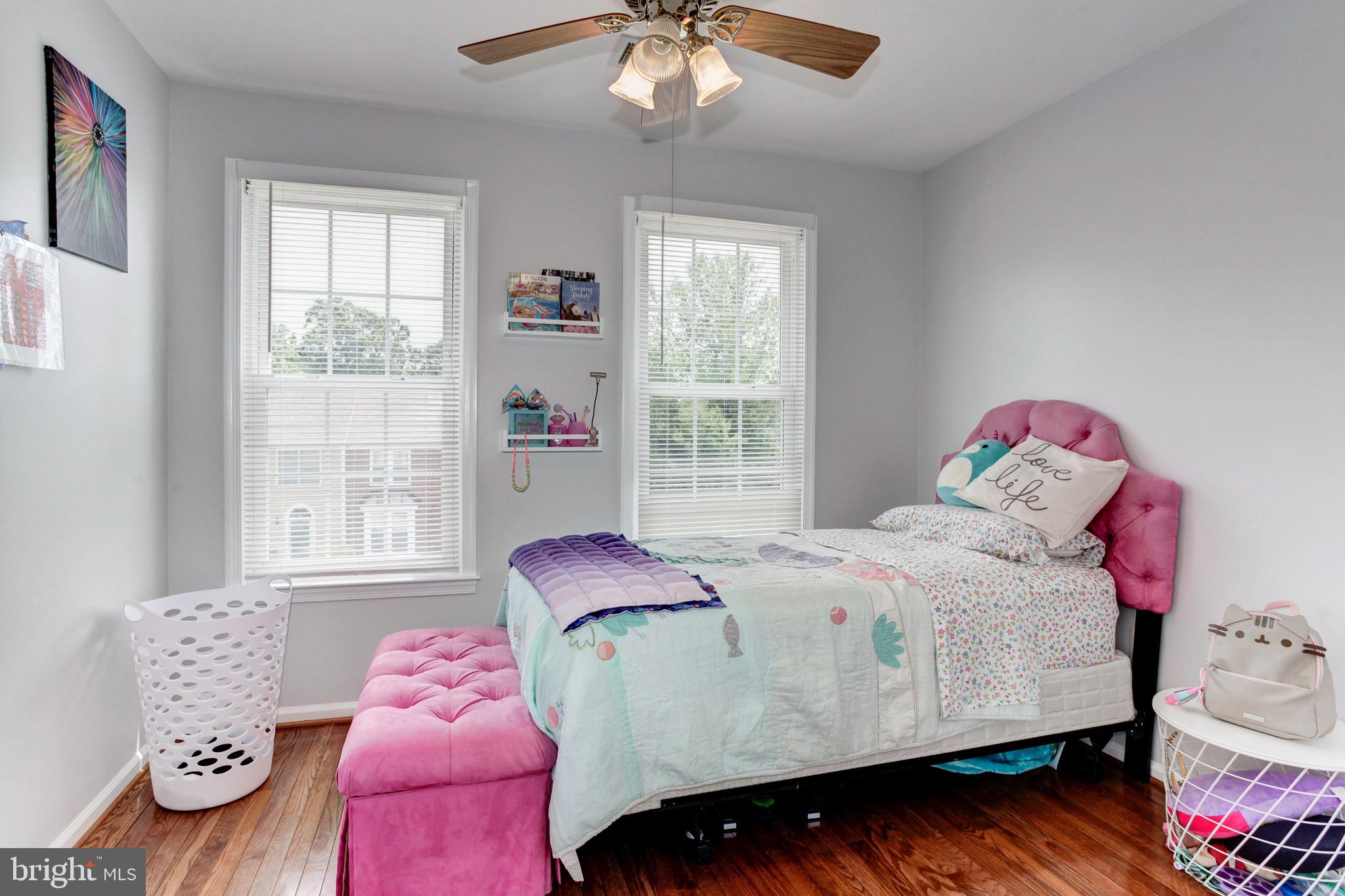 7728 Hickory Glen Way Springfield, VA 22153 - Photo 18 of 26 a bedroom with a bed and window