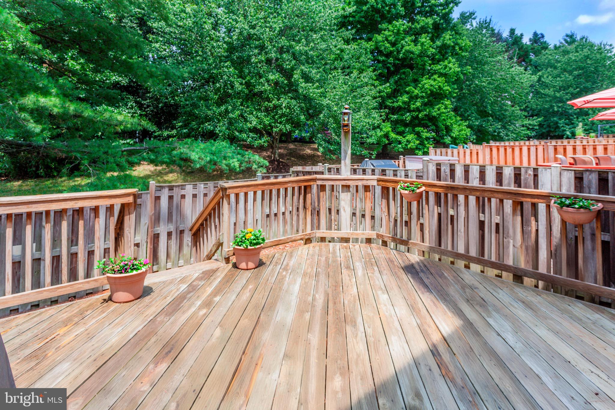7728 Hickory Glen Way Springfield, VA 22153 - Photo 3 of 26 a view of deck with wooden floor and fence