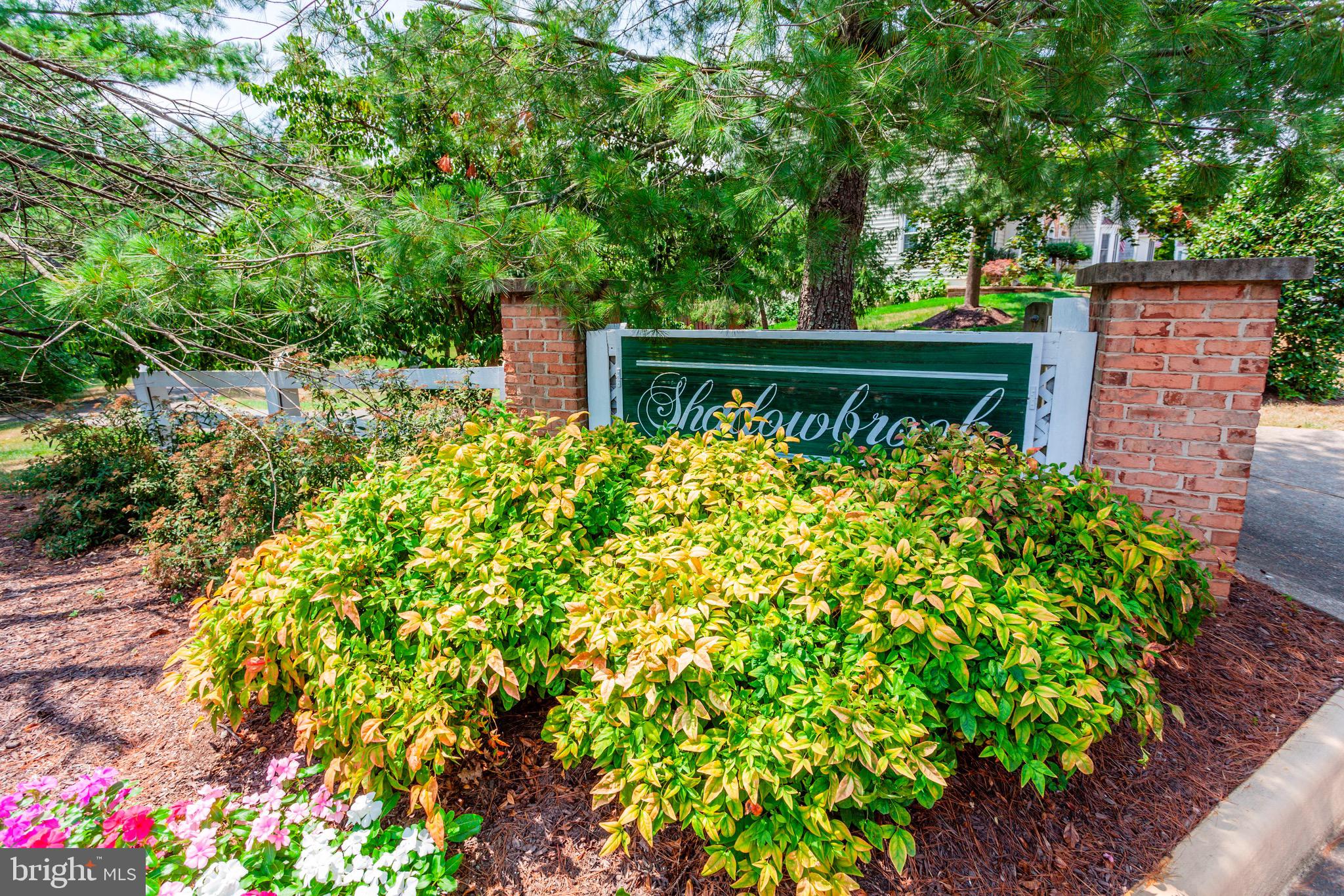 7728 Hickory Glen Way Springfield, VA 22153 - Photo 25 of 26 a view of a garden with wooden fence