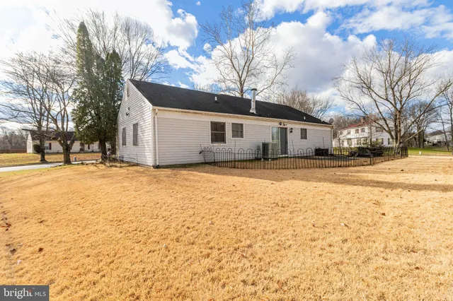 a view of a house with snow on the road