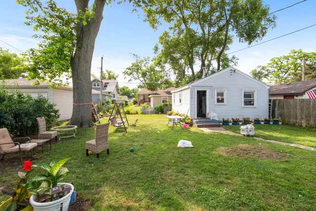 a front view of house with a garden