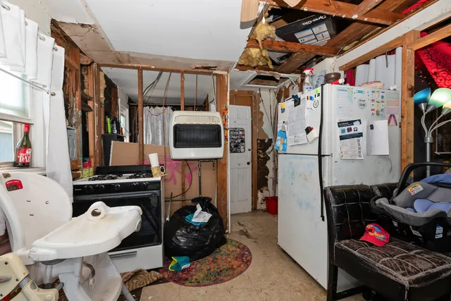 a bathroom with a toilet and a shower curtain