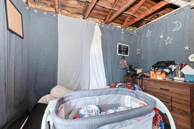 a bedroom with furniture and a bed