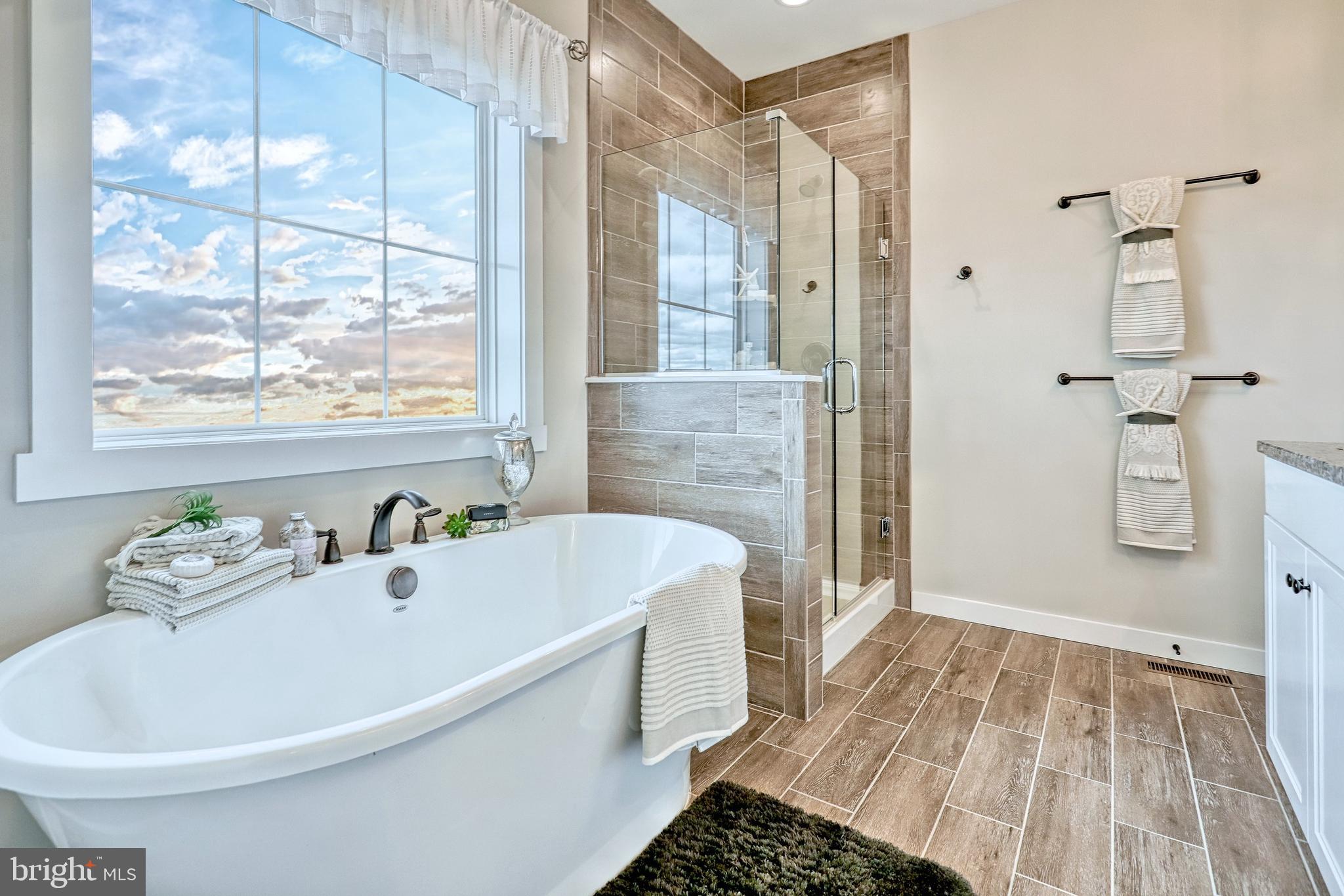 500 Slugger Alley, Unit MILTON Frederick, MD 21702 - Photo 11 of 53 a bathroom with a bathtub and a shower