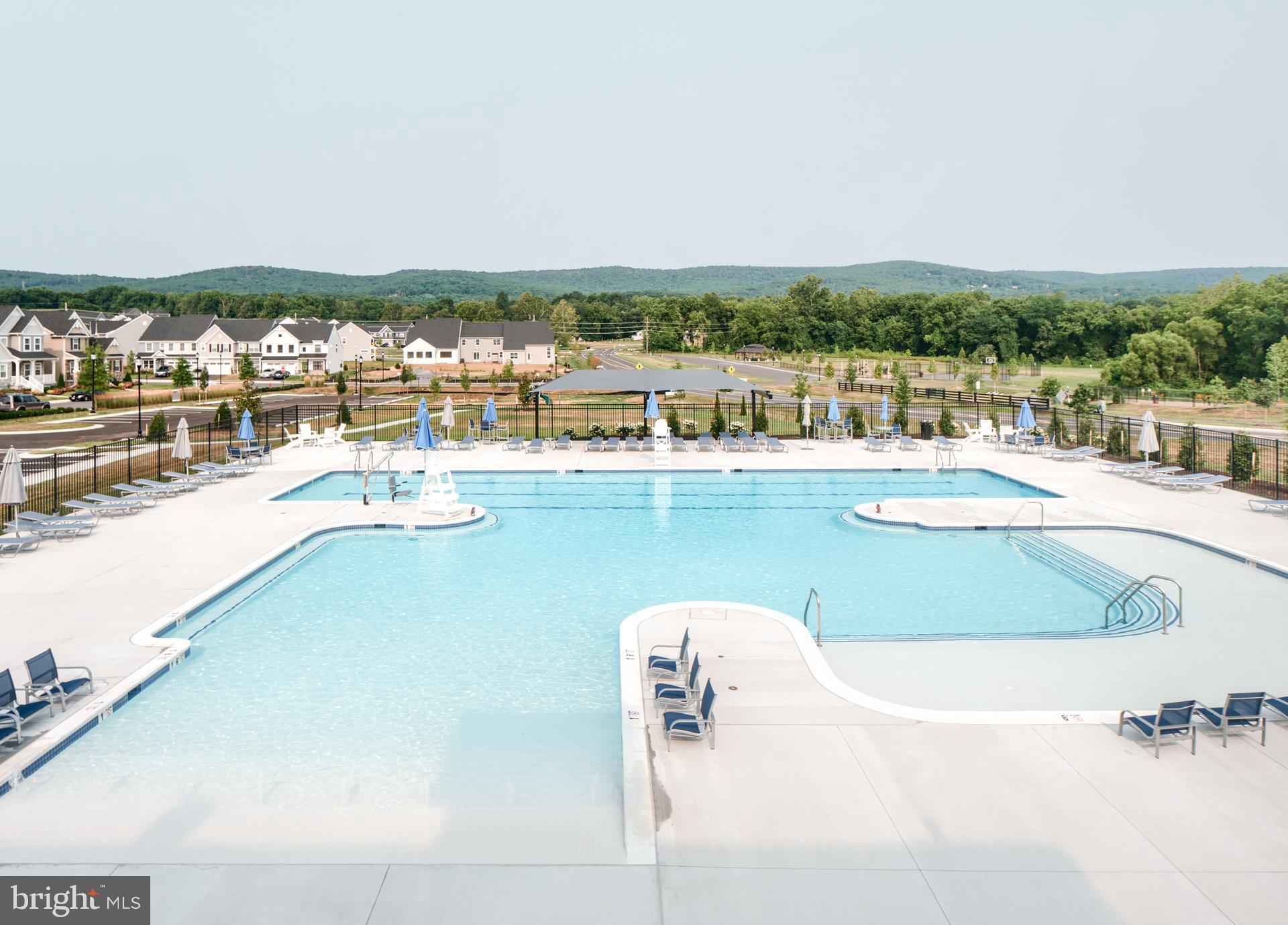 500 Slugger Alley, Unit MILTON Frederick, MD 21702 - Photo 22 of 53 a view of a swimming pool and lake view