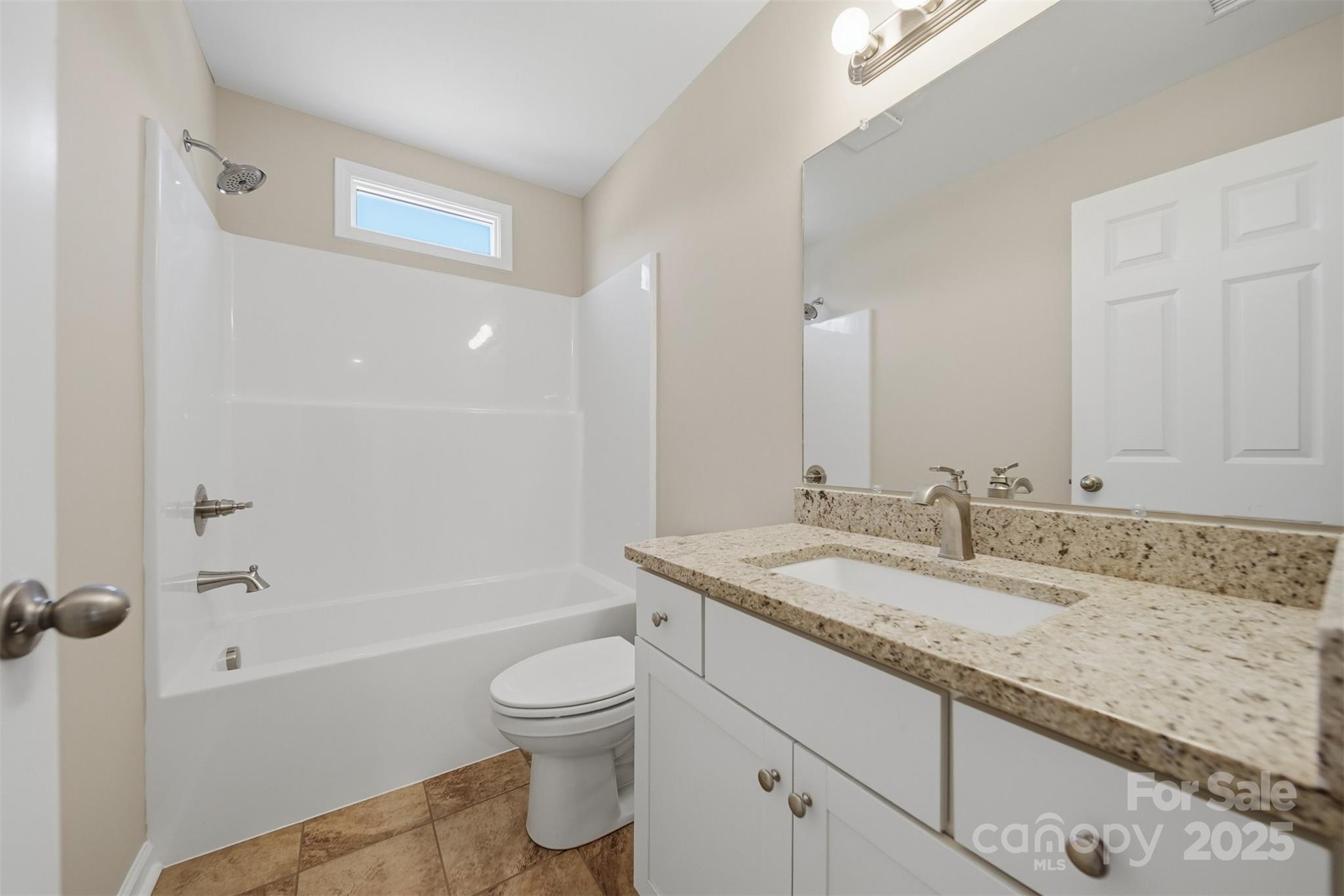 2707 Sandy Ford Road Newton, NC 28658 - Photo 26 of 47 a bathroom with a granite countertop sink toilet and shower