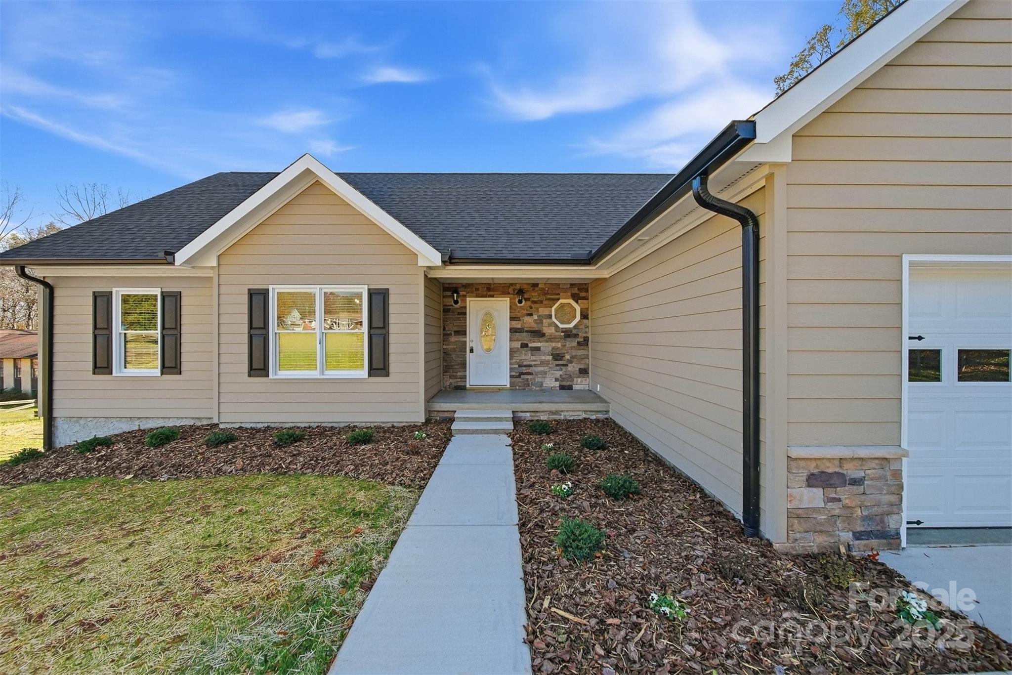 2707 Sandy Ford Road Newton, NC 28658 - Photo 3 of 47 a front view of a house with garden