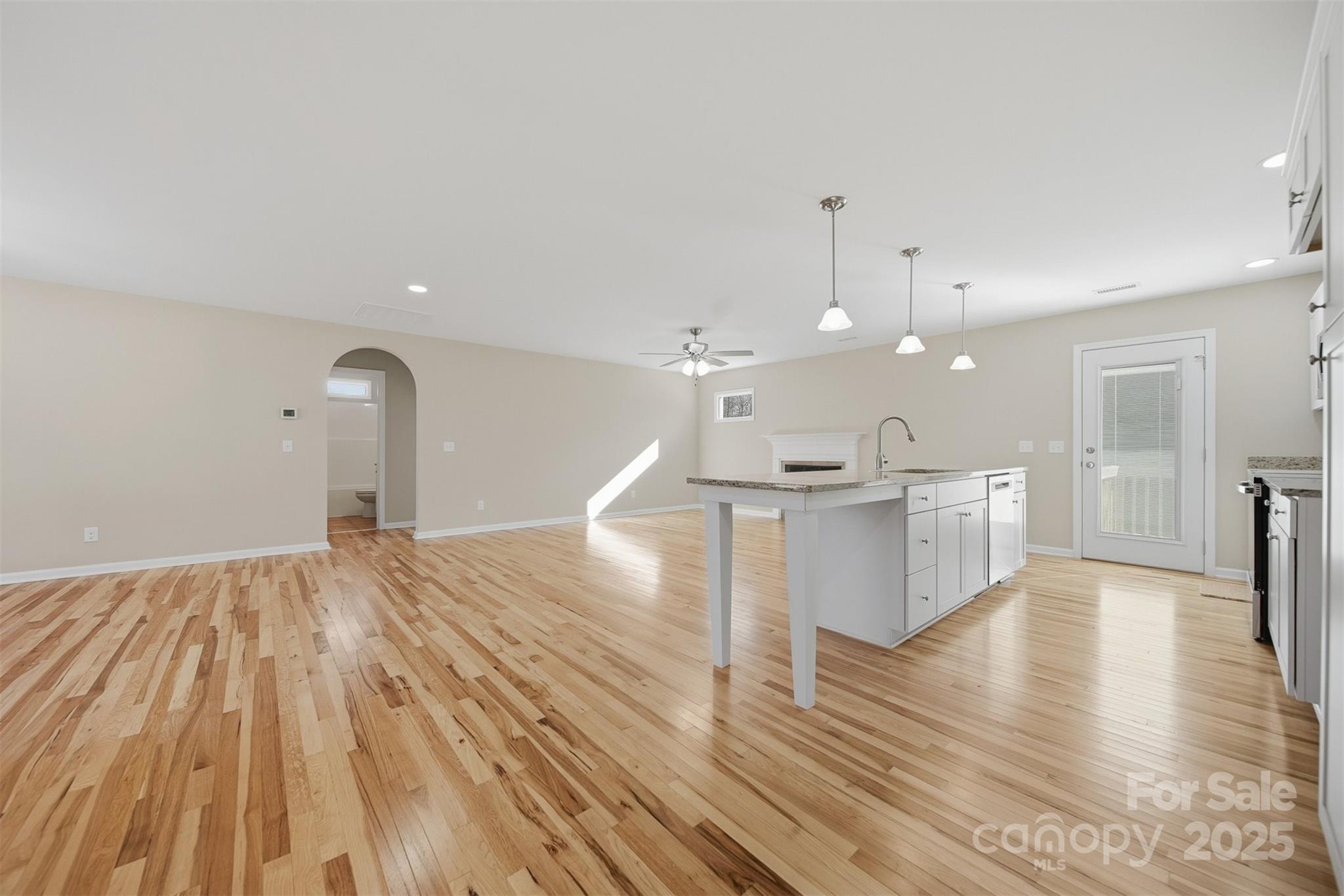 2707 Sandy Ford Road Newton, NC 28658 - Photo 8 of 47 a view of kitchen with cabinets and wooden floor