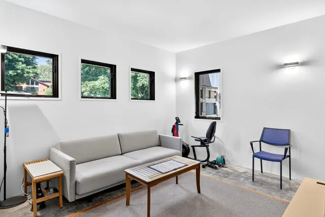 a view of a chairs and table in the balcony