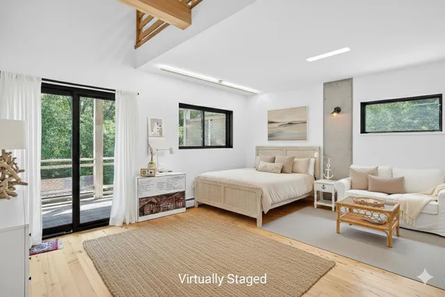 an aerial view of a house with swimming pool and a yard