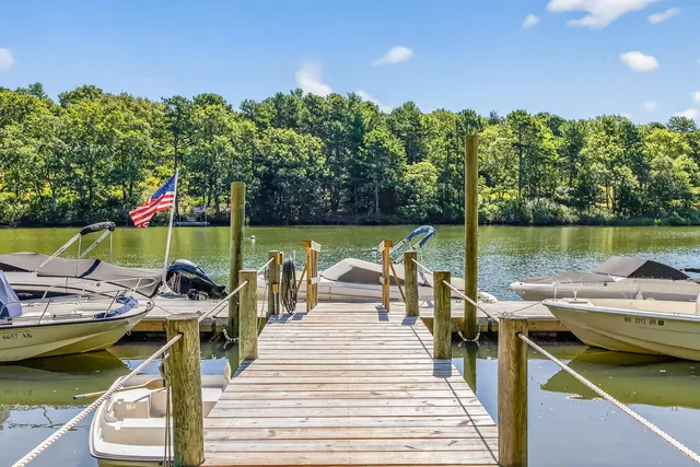 a view of a patio with chairs next to a yard