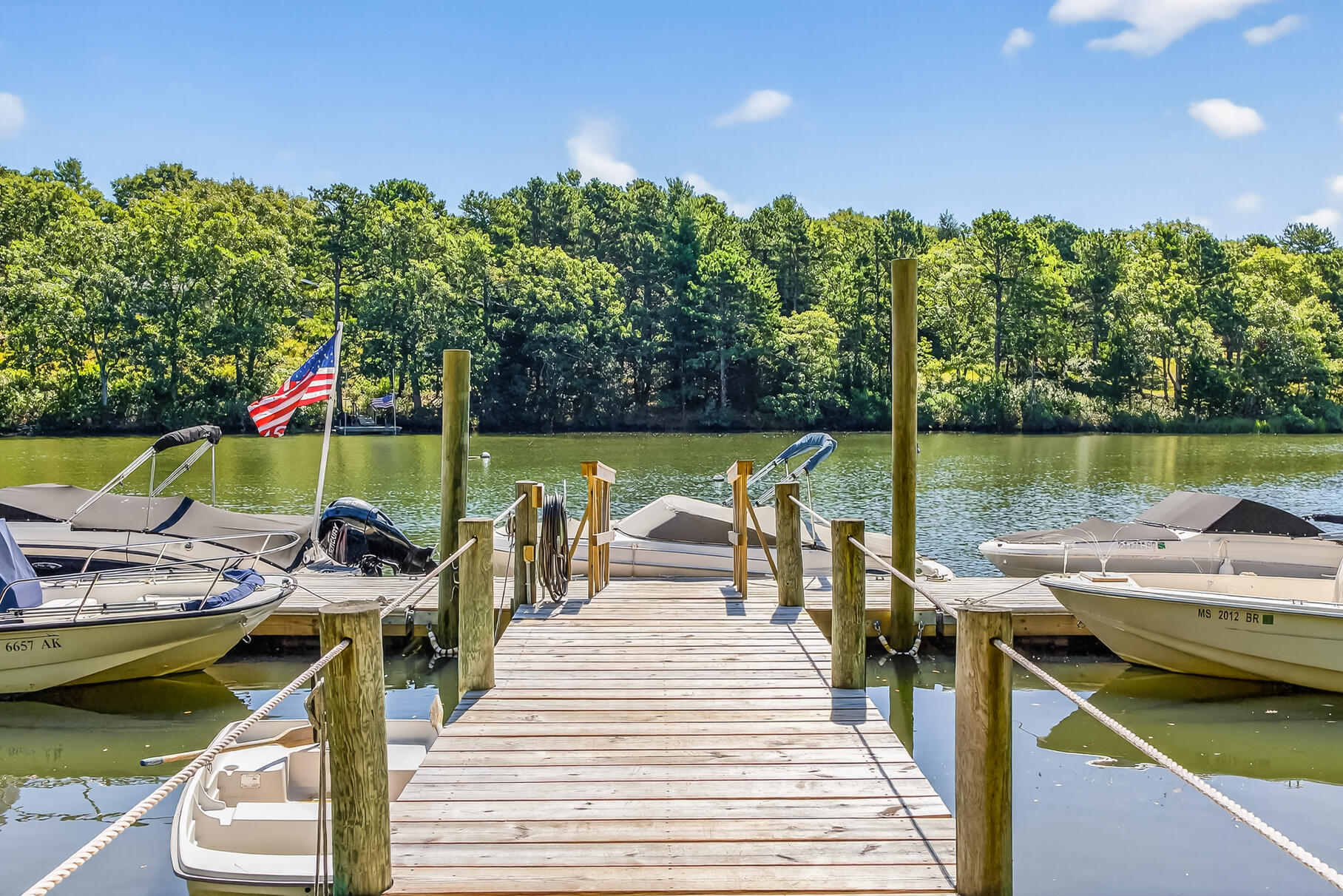 50 Rivers Edge Road East Falmouth, MA 02536 - Photo 4 of 55 a view of a patio with chairs next to a yard