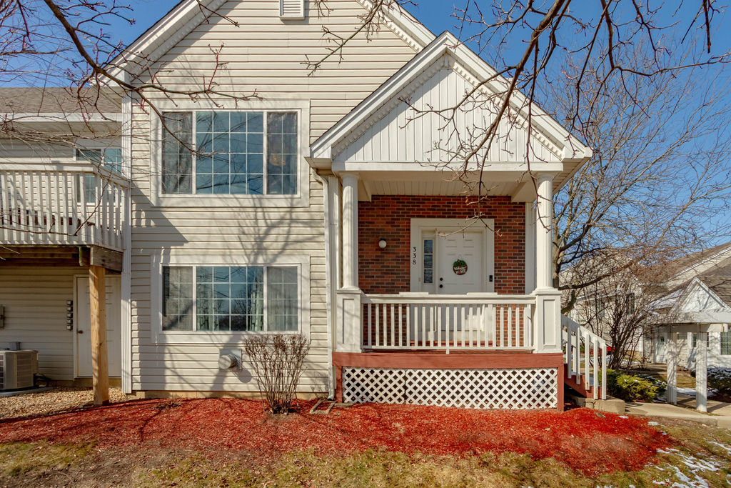 338 Springmist Court Bolingbrook, IL 60440 - Photo 1 of 29 a view of a house with a small yard and wooden floor and fence