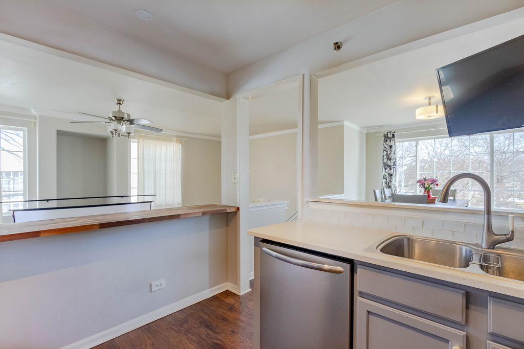 338 Springmist Court Bolingbrook, IL 60440 - Photo 13 of 29 a kitchen with a sink cabinets and appliances