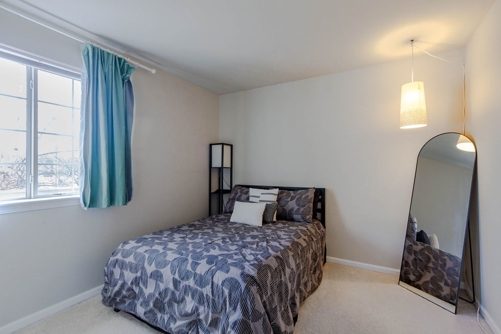 338 Springmist Court Bolingbrook, IL 60440 - Photo 19 of 29 a bedroom with a bed and a mirror