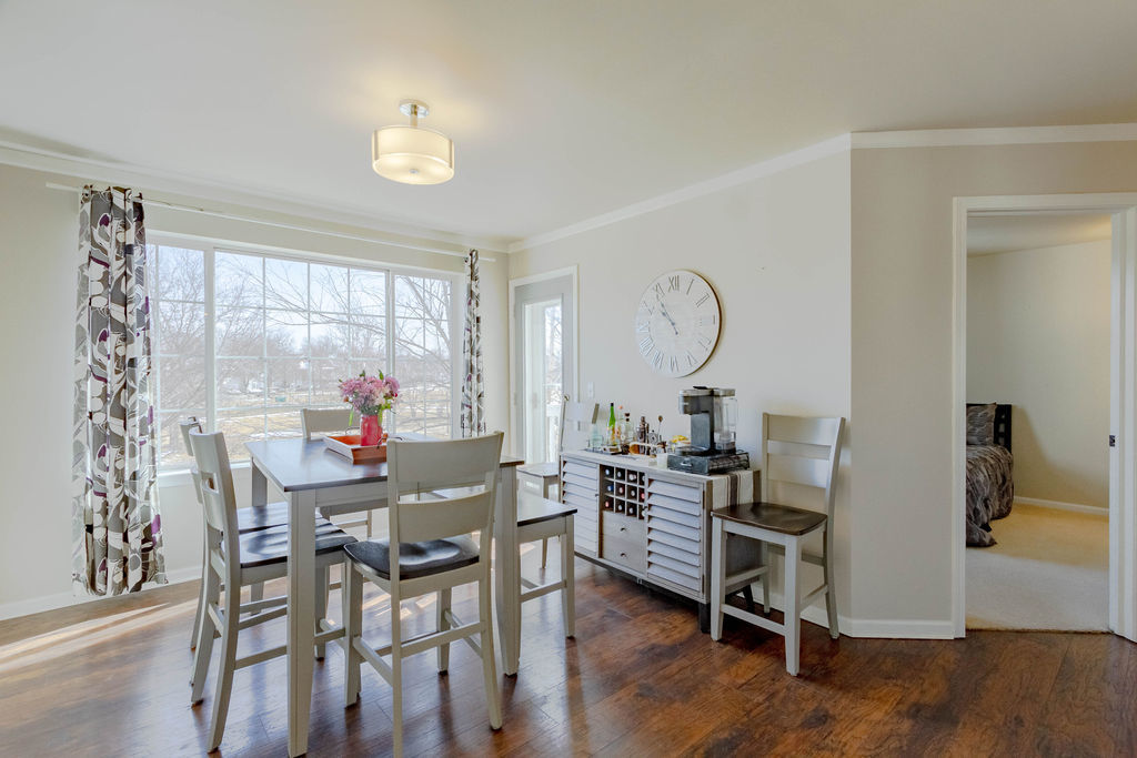 338 Springmist Court Bolingbrook, IL 60440 - Photo 8 of 29 a view of a dining room with furniture window and wooden floor