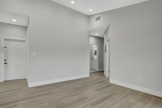 a view of a livingroom with wooden floor