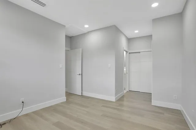 a bathroom with a sink shower and a mirror