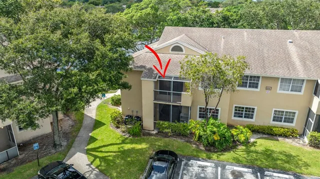 an aerial view of a house with a lake view