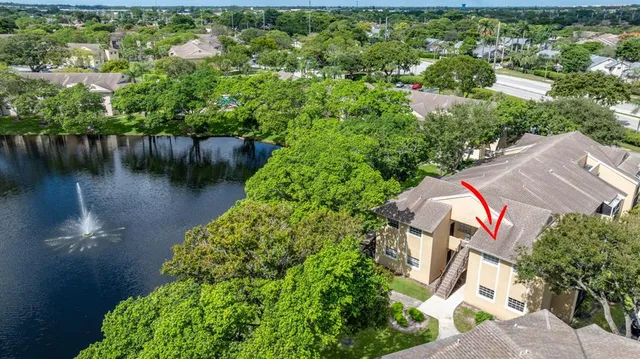 a view of a lake with a yard