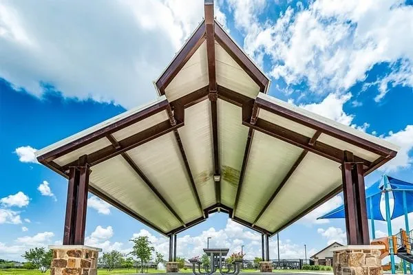 a view of outdoor space with wooden floor and a ceiling fan