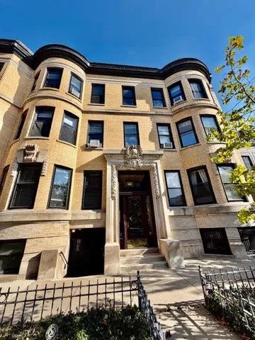 a front view of a multi story residential apartment building